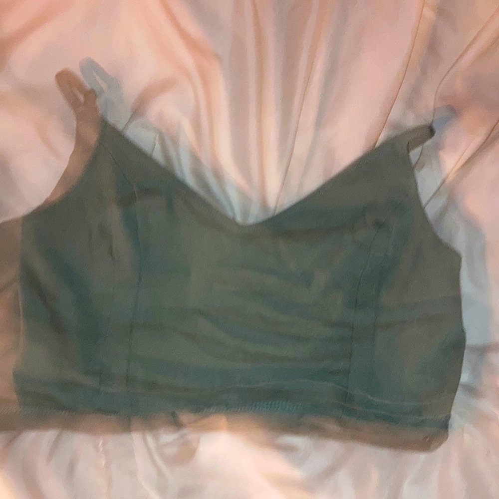 Adjustable strap is a large, super comfy and is a really pretty green.